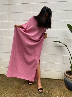 Embrace the gentle waves and sunny shores with our double gauze cotton kaftan in bubblegum pink. This versatile floor-length kaftan falls gracefully just above the ankles (depending on your height), making it the perfect beach dress or cover up. Crafted from light and airy double gauze cotton, it's your essential for a night on the town, a day by the sea, or just running errands. Summer Maxi Dress With Relaxed Fit, Pink Maxi Dress For Summer Daywear, Pink Maxi Dress With Side Slits For Spring, Pink Beachwear Kaftan For Spring, Breezy Spring Loungewear Maxi Dress, Breezy Spring Maxi Dress For Loungewear, Breezy Maxi Dress For Spring Loungewear, Pink Flowy Beach Dress For Beach Season, Pink Flowy Beach Dress