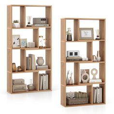 two bookshelves that have various items on top of each other in front of white background