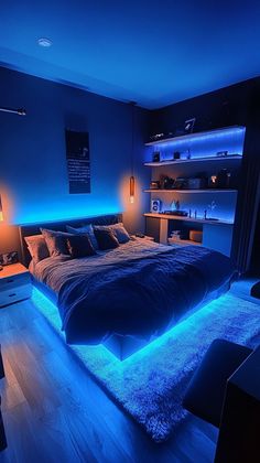 a large bed sitting in a bedroom under blue lights