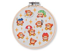 a cross stitch pattern with mario and luigi's faces on the front, as well as other characters