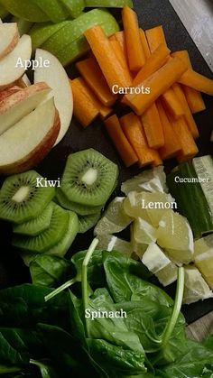 various fruits and vegetables cut up on a cutting board with the words apples, carrots, kiwi, lemon, spinach, spinach