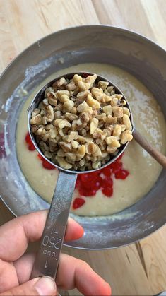 a spoon with some food in it on a table