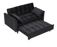 a black couch and ottoman with pillows on it