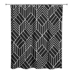 a black and white shower curtain with an abstract geometric design on it's side