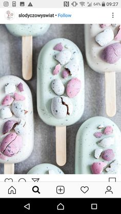 several popsicles with marshmallows on them are arranged in the shape of hearts