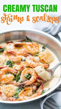 a pan filled with shrimp and scallops on top of a table