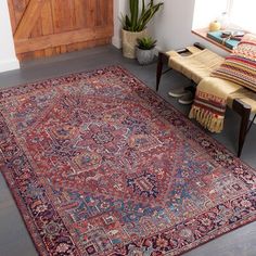 This indoor area rug rolls out a vibrant look and a warm, cushioned foundation on your floors. It's power-loomed from polyester, a tough material that stands up to floor heating, and it showcases a rich burgundy hue for plenty of boho style. With a low 0.08" pile height, it's ideal for creating an inviting feel in high-traffic spots like your bedroom or family den with the added benefit of being easy to clean. Just remember that even though it has a canvas backing, it performs best when paired w Synthetic Rugs, Bedroom Area Rug, Bohemian Area Rugs, Red Area Rug, Traditional Area Rugs, Online Home Decor Stores, Red Rugs, Antique Rugs, Colorful Rugs