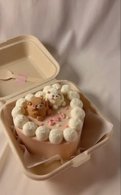 there is a cake in the shape of a cat with marshmallows on it