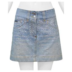 Resurrection Vintage is excited to offer a vintage Dolce & Gabbana denim mini skirt featuring yellow stitching, back patch pockets, and a rhinestone and pearl gradient on the front and back of the skirt. Dolce & Gabbana Size 38 Cotton Excellent Vintage Condition Authenticity Guaranteed Rhinestone Denim Skirt, Hslot Outfit, Desired Reality, Back Patch, Denim Mini, Clothing Ideas, Crystal Pearls, Jean Skirt, Denim Mini Skirt