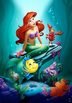 the little mermaid and her friends are sitting on top of an underseal with blue water