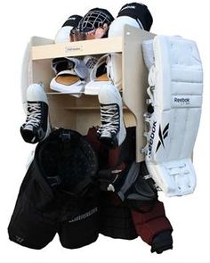 the hockey goalie's gear is stacked on top of each other