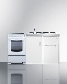 a white stove top oven sitting inside of a kitchen