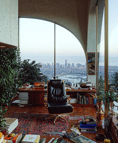 a living room filled with furniture and a large window