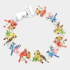 This magnetic and enameled bracelet showcases an array of popular backyard birds. The Bird Bracelet boasts the presence of American Goldfinch, Blue Jay, Ruby-throated Hummingbird and Cardinal, rendering it an ideal choice for the armchair birder or active birder in your life. Size: 7 - 7.5" (approximately) Magnetic closure Made of metal alloy (silver and copper and other metal alloy) with high quality plating( Lead and Nickel Compliant Bird Bracelet, Bloodstone Jewelry, Animal Themed Jewelry, American Goldfinch, Aventurine Jewelry, Amazonite Jewelry, Ruby Throated Hummingbird, Mountain Jewelry, Baltic Amber Jewelry