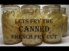 four jars filled with sliced bananas sitting on top of a white countertop next to the words, let's fry the canned french fry cut