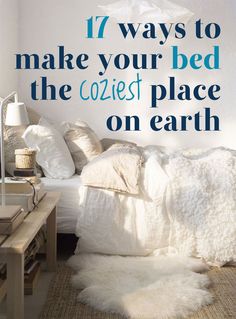 a bed with white blankets and pillows on it