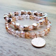 Rose Gold And Pale Pink Beaded Stacking Bracelet Set. One Bracelet Is Rose Gold Cube Beads With Pale Pink Czech Glass Beads. The Other Bracelet Is Beaded With Pale Pink Czech Glass Beads With A Round Rose Gold Charm. Both Stretch Bracelets Are Size 7. Stunning Stacked. Rose Gold Stackable Bracelet With Round Beads, Rose Gold Beaded Bracelets With 8mm Beads, Rose Gold Faceted Bead Bracelet, Hand-strung Rose Gold Beaded Bracelets For Everyday, Adjustable Rose Gold-plated Beaded Bracelets, Gold Cube, Stretch Beaded Bracelets Diy, Rose Gold Charms, Rose Gold Beads