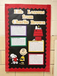 a bulletin board on the side of a wall with writing about charlie brown's life