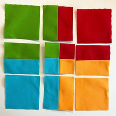 four different colored pieces of cloth laid out on top of each other