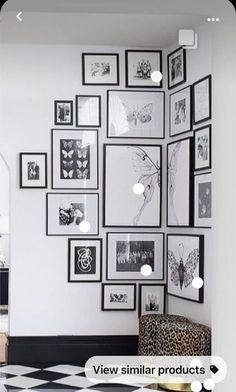 a white room with black and white pictures on the wall