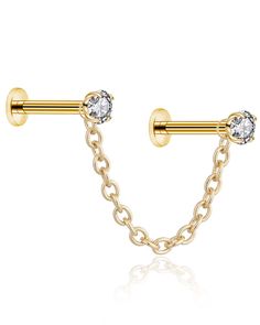 two piercings with chain and crystal stones on each end, in yellow gold tone