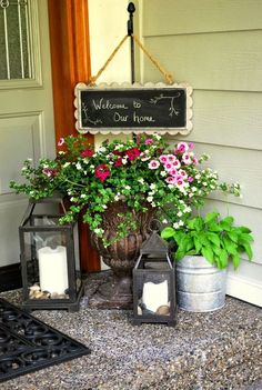 flowers and candles are sitting on the front porch