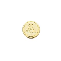 a small gold button with the letter a on it's front and back side