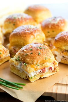 several mini sandwiches with meat and cheese on them