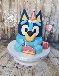 a birthday cake with a cartoon character on it