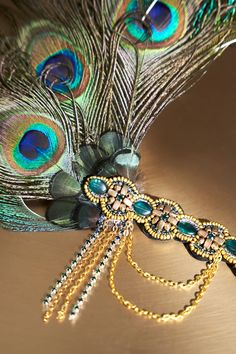 Step back in time to the Jazz Age with this feather headband, a modern nostalgia for the glamorous 1920s. Features: Intricately beaded headband Gorgeous Peacock Feathers Adjustable elastic band Gorgeous chain tassels Adjustable Flapper Headpiece With Feathers, Beaded Peacock Feather, Peacock Headband, Modern Nostalgia, Beaded Peacock, Gatsby Headpiece, 1920s Headpiece, Vintage Headpiece, The Jazz Age