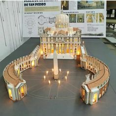 a model of the white house with candles in front