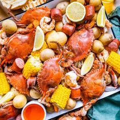 lobsters, corn and potatoes on a platter