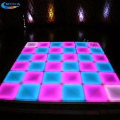 an illuminated dance floor with squares on it