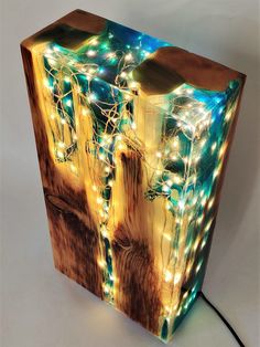 a wooden box that has some lights on it