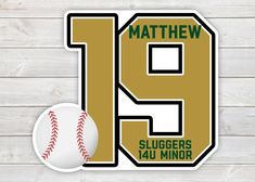 the number nine with a baseball on it is next to a sign that says mathew sluggers jau minorr