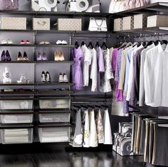 an organized closet with clothes and shoes