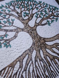 a mosaic tree with blue leaves on it