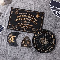 various items are laid out on the ground near each other, including an astrological sign