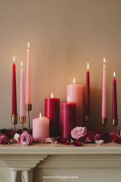 A Valentine's Day mantle glowing with pink and red candles, rose petals scattered below, creating a cozy ambiance. Valentines Fireplace Decorations Mantels, Valentines Day Entryway Table, Valentines Day Shelf Decor, Fireplace Mantle For Valentine’s Day, Cozy Valentines Decor, Valentine’s Day Ideas At Home, Valentine Fireplace Decor, Gold Valentines Day Decor, Valentines Mantel Decor