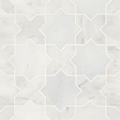 a white marble tile pattern with geometric shapes