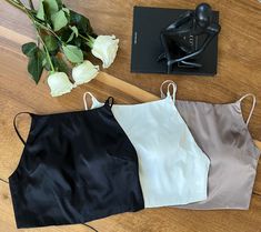 Introducing our minimalist and elegant crop cami seamless bra top with adjustable straps. This item is made with 91% mulberry silk and 9% spandex, providing a soft, comfortable, breathable, and stretchy feel. It's versatile and perfect for a wide range of occasions for day & night and lounging in. You will look effortlessly beautiful wearing this on its own or with a cardigan/light jacket.  Colors:  Silky black/Pearl White (No longer available)/Mocha The photos and video were taken under natural light with no filter. Sizes: S: 79 - 87 M: 86 - 94 Washing instruction: - Handwash in cold water  - Hang dry and avoid direct sunlight  - Low temp iron - No tumble dry Chic Crop Top Camisole With Built-in Bra, Elegant Crop Top With Delicate Straps, Elegant Camisole Crop Top With Delicate Straps, Elegant Crop Top With Adjustable Straps For Night Out, Chic Seamless Cami Crop Top, Elegant Cami Crop Top With Delicate Straps, Chic Camisole With Spaghetti Straps And Removable Bra Pads, Chic Camisole Tank Top With Removable Bra Pads, Chic Seamless Halter Camisole Top