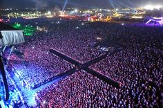 an aerial view of a concert with the stage lit up and people in the audience