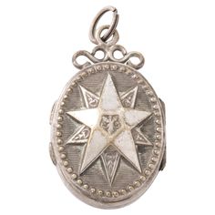 A large raised star covers most of the face on both sides of this French Victorian Silver Locket. There are collectors of star jewelry among you who would find this small locket fun to add to a bracelet or neck chain.The locket is oval. The jeweler made it highly textured. There are raised silver balls around the border and under the star, the background is ridged with horizontal lines. The texture kept the locket free from scratches. Inside there are two compartments. The French made these lock Photo Fix, French Victorian, Silver Lockets, Star Jewelry, Under The Stars, Silver Stars, Locket, Jewelry Necklace Pendant, Star Wars