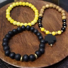 Black And Yellow Beaded Bracelet Set Adjustable Yellow Bracelet With Wooden Beads, Yellow Beaded Spiritual Bracelets, Spiritual Yellow Beaded Bracelets With 8mm Beads, Casual Yellow Beaded Bracelets With 8mm Beads, Casual Yellow Beaded Bracelet With 8mm Beads, Adjustable Yellow Wooden Beaded Bracelets, Yellow Bracelet With Round Wooden Beads, Yellow Casual Jewelry With 8mm Beads, Casual Yellow Jewelry With 8mm Beads