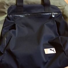 Nwot - Puma Transition Lifestyle Bag. Beautiful Khaki & Black Color Combo. Bag Holds All Your Yoga Class Needs. There Is An Outside Vertical Zip Pocket W/ Horizontal Pocket On Other Side Of Bag. Shoulder Strap - 25” Drop. Handles Have A 6” Drop. Nylon Lining With Puma Logo. Very Stylish Bag. 100% Polyester - Po #Jw1337bg / Rn #100759 / Ca #57289. Made In China. #Pumatransitionbag #Pumayogabagvaikas #Pumaosfalifestyleyogabag Excellent Condition. Puma Gym Bag Woman, Versatile Gym Bag With Pockets For On-the-go, Puma Logo, Yoga Bag, Yoga Class, Stylish Bag, Bag Shoulder, Color Combo, Black Green