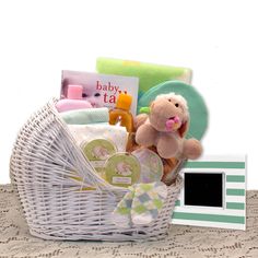 a baby gift basket with a teddy bear and other items