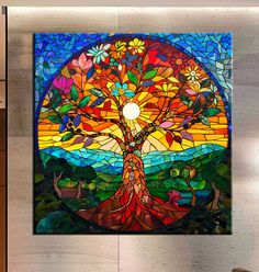 a large stained glass window with a tree on it