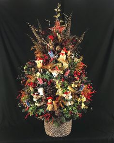 a basket filled with lots of different types of stuffed animals on top of a black background