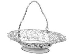 a silver basket on a stand with rope