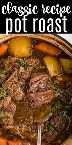 a close up of a pot roast with carrots and potatoes